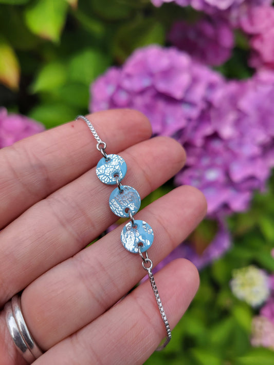 Light blue and silver adjustable bracelet