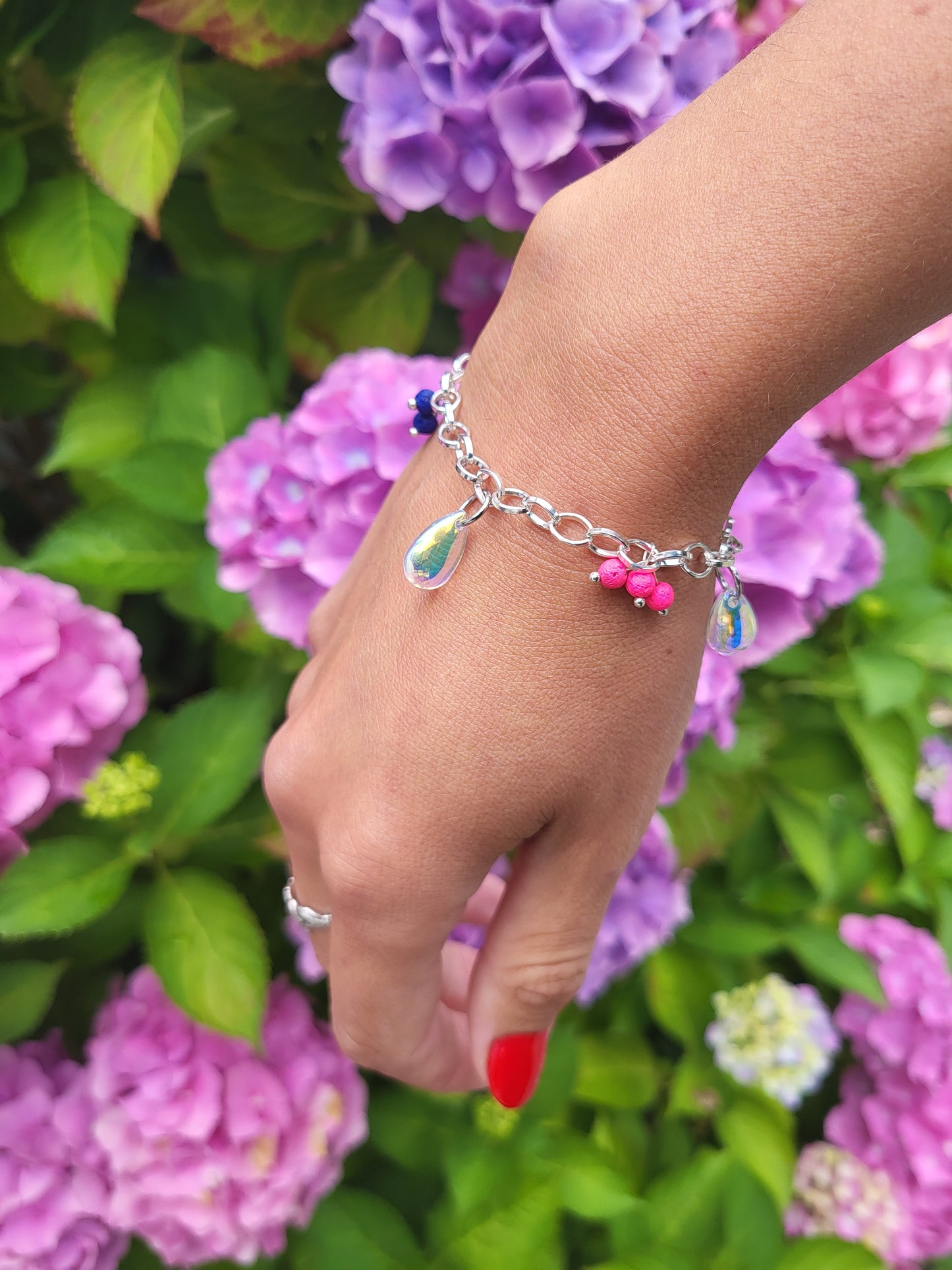 Chunky silver bracelet with colourful charms