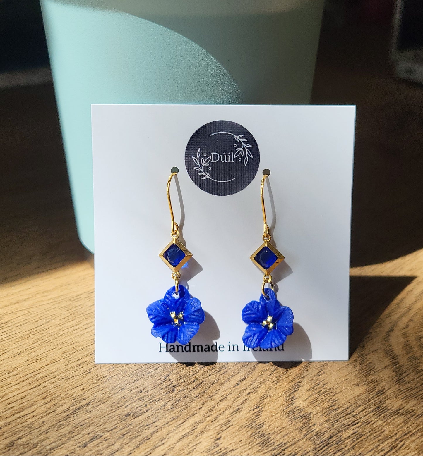Blue and gold flower earrings