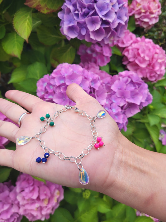 Chunky silver bracelet with colourful charms