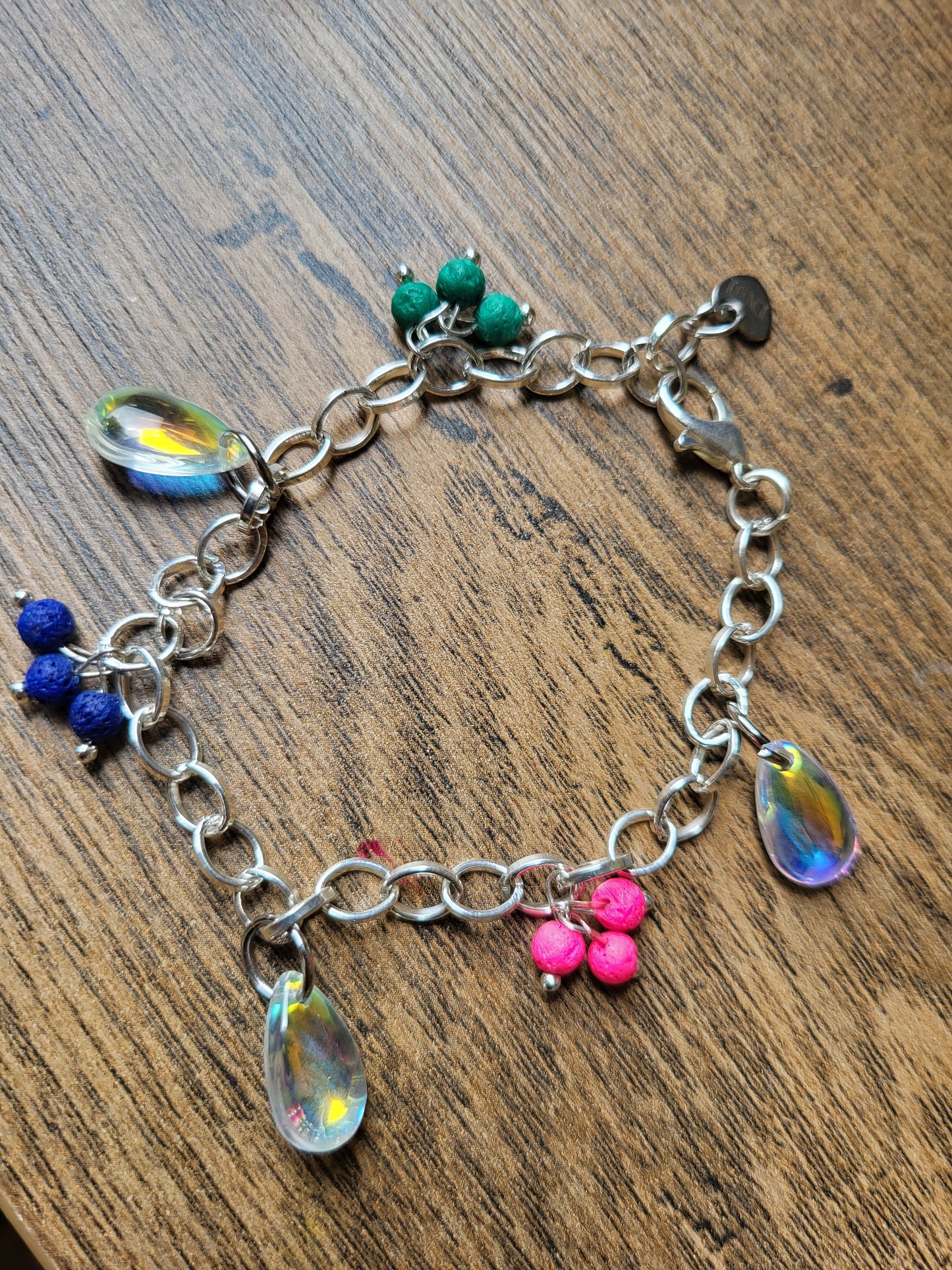 Chunky silver bracelet with colourful charms