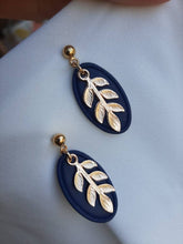 Load image into Gallery viewer, Navy and gold dangling earrings || leaf earrings || polymer clay earrings || handmade in Ireland || gifts for her - Dúil
