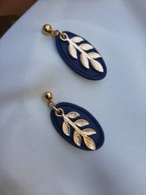 Load image into Gallery viewer, Navy and gold dangling earrings || leaf earrings || polymer clay earrings || handmade in Ireland || gifts for her - Dúil
